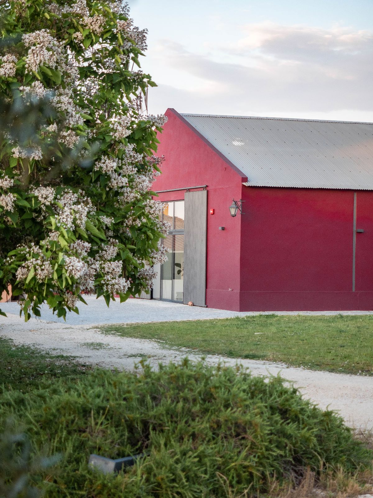 The red Country Club building with its sliding barn door